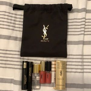 YSL travel size lipgloss, mascara, primer and bag